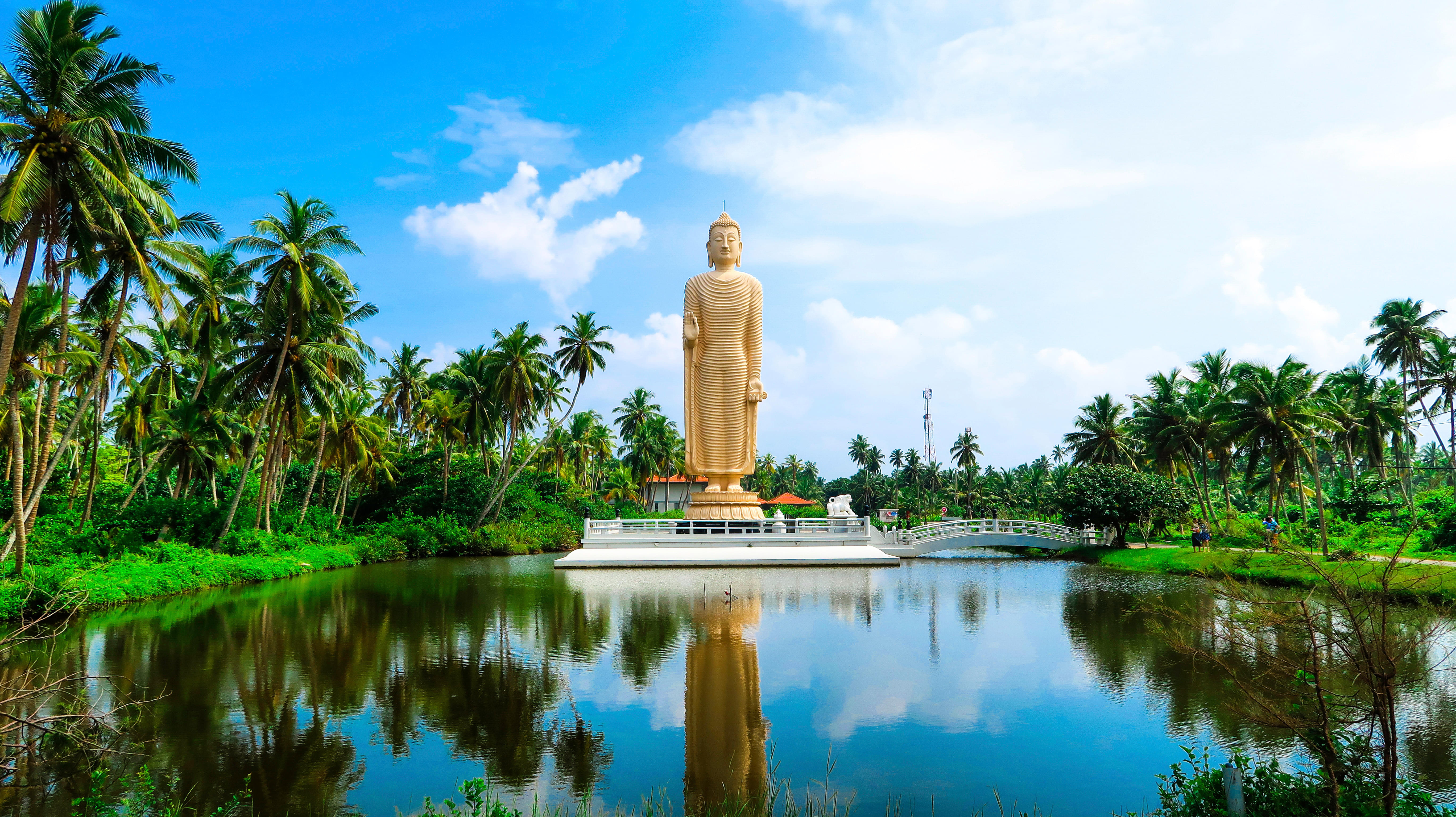 Iconic Buddha statue resting on calm  waters with Sri Lanka holiday packages